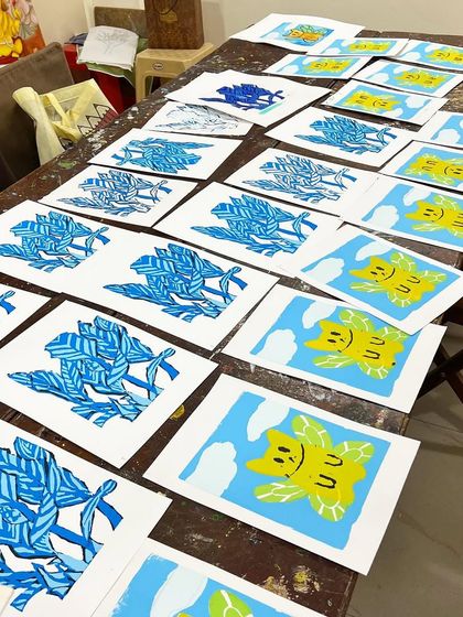 A table full of freshly made serigraph prints. It's so rewarding to see a whole edition of your artwork come to life.