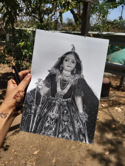 The full view of the unframed Radha Rani sketch, held up to show the complete composition before framing.