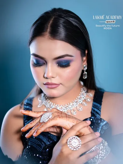 This detailed shot highlights the diamond jewelry and the perfectly blended blue eyeshadow. We teach how to coordinate makeup with accessories for a polished and complete look.