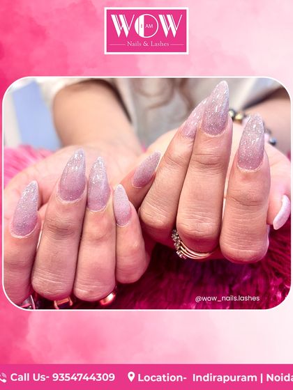 Feel the fantasy with these extra-long, sparkling stiletto extensions. Coated in a shimmering lavender glitter polish, these nails are designed for those who love to make a bold and glamorous statement.
