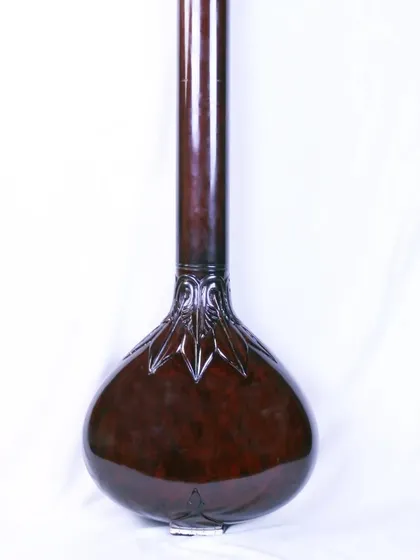 The base of the Manu Shrivastava style tanpura, showing the beautiful carving where the neck joins the body.