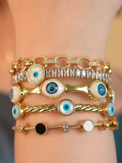 All eyes on you. This is how I love to stack my evil eye bangles for maximum protection and style. It's a look that's both powerful and chic.