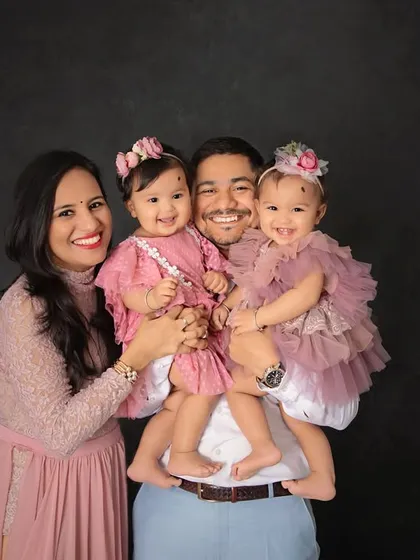 A picture perfect moment for this beautiful family of four. Celebrating the twins' first birthday with a portrait that they will look back on for a lifetime.