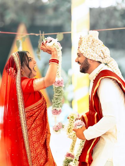 The fun and playful varmala ceremony, with the bride's makeup staying perfect through all the excitement.