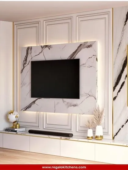 This design combines classic wall molding with a striking marble TV surround. The result is a timeless and elegant entertainment center that feels both modern and traditional.