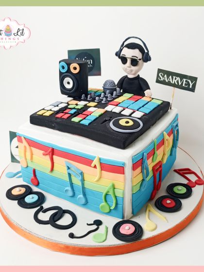 Drop the beat with this vibrant DJ-themed cake. It's topped with a detailed, edible DJ console, a figurine with headphones, and surrounded by colorful musical notes, perfect for a young music lover's birthday bash.