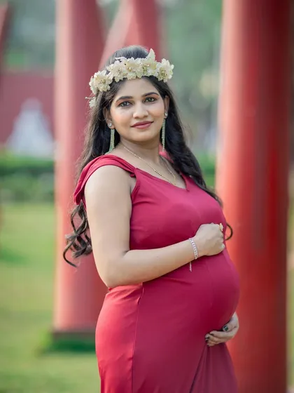 A beautiful half-length portrait of a mom-to-be, with a soft and happy expression.