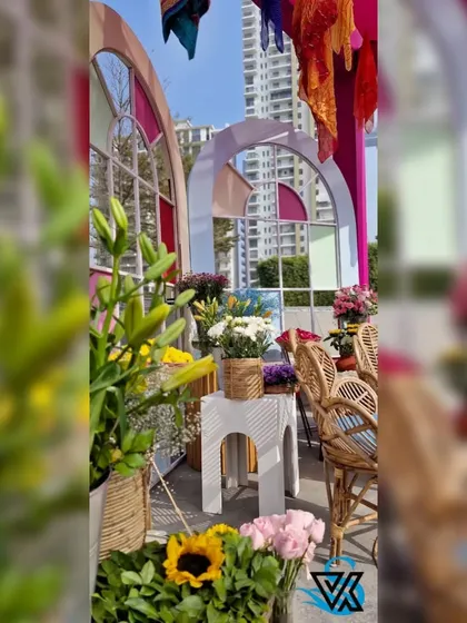 A close-up of the colorful decor, showing how we mix different flowers, plants, and structures to create a visually rich environment.