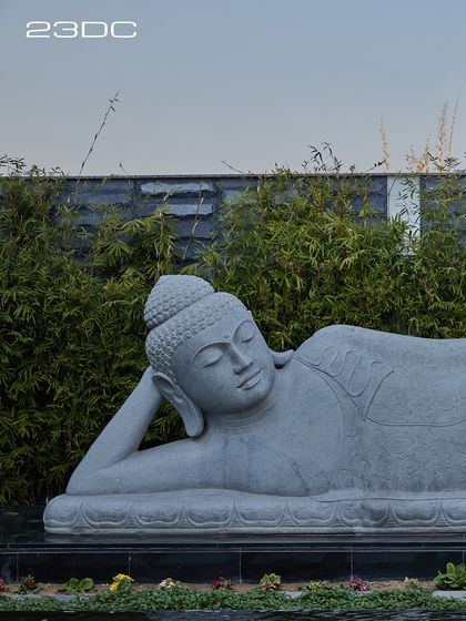 We believe in creating spaces for peace and reflection. This large reclining Buddha statue, set against a backdrop of green bamboo, brings a powerful sense of presence and tranquility to the garden. It is a reminder that happy homes are where peace resides.