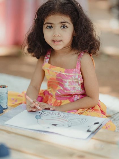 A young guest enjoying the kids' corner, a thoughtful addition to ensure that even the littlest attendees have a wonderful time.