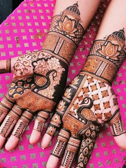 This design features bold peacocks on the palms, with one done in a fill-in style and the other using negative space for a unique look.