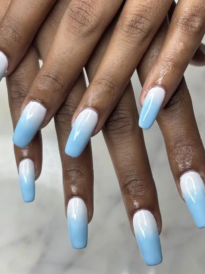 A dreamy blue and white ombre on long, square-shaped extensions. The gradient is soft and cloud-like, perfect for a fresh and modern look.