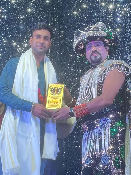 Being presented with an award by Magician Ajooba ji. His blessings and recognition fuel my journey forward.