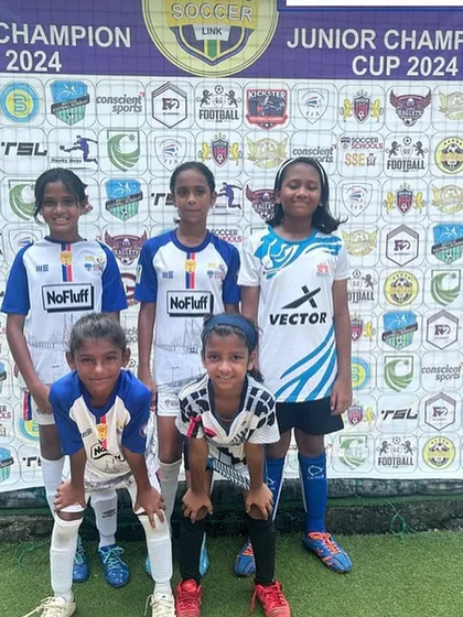 Our young girls team posing for a photo at The Soccer Link tournament. Gaining match experience from a young age is a core part of our development philosophy.