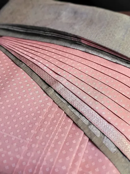 Another angle of the pre-draped saree, showing the perfectly aligned pleats.