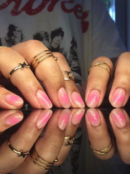 A full view of the pretty pink jelly nails.