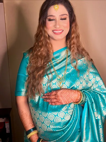 A beautiful shot capturing her holding her baby bump, radiating pure joy and love.