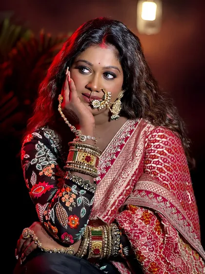 A profile shot that highlights the contour and glow on her dusky skin, along with the intricate details of her jewellery.