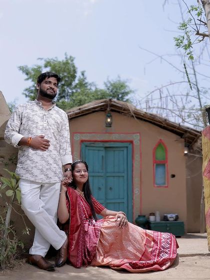 A beautiful family or couple portrait taken at our rustic village set, showcasing the authentic and picturesque quality of this popular backdrop.
