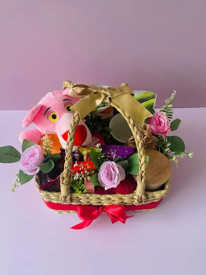 A side view of the Pink Panther themed basket, showing how I pack it to be full and festive from every angle.