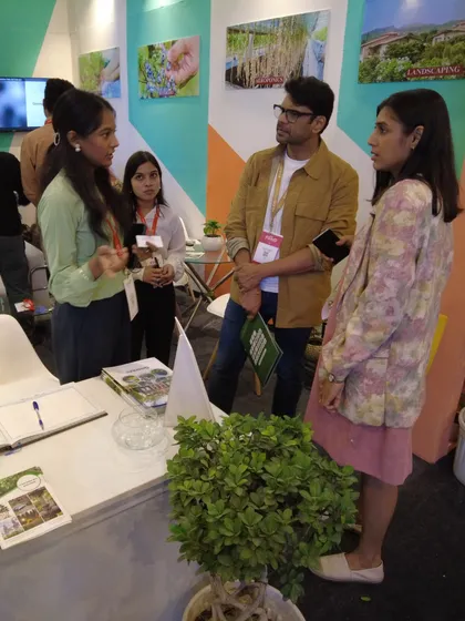 Engaging in a detailed conversation with interior designers at the event. These interactions are invaluable for understanding the latest trends and needs in the design community.