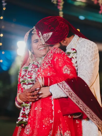 A moment of pure, unscripted joy. We live for these candid whispers and radiant smiles that truly define the connection between two people. This is the essence of our photojournalistic approach to wedding photography.
