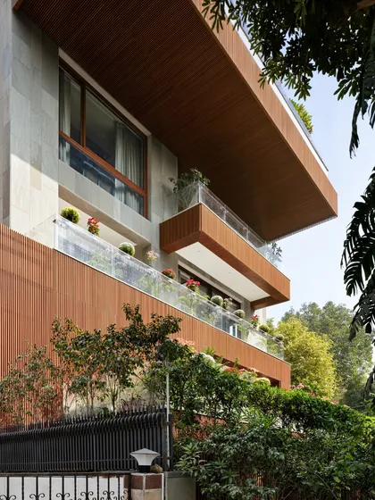 This facade demonstrates how acetylated wood can be integrated with green balconies. The combination of sustainable timber and biophilic elements creates a building that is both eco-friendly and visually appealing.