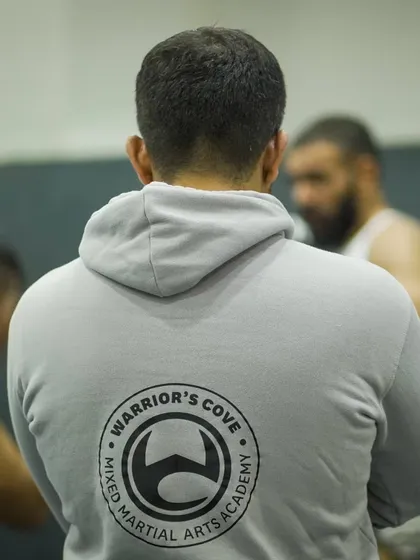 A coach wearing our academy's hoodie observes the action. Our brand is built on the back of the hard work and dedication shown by our team.