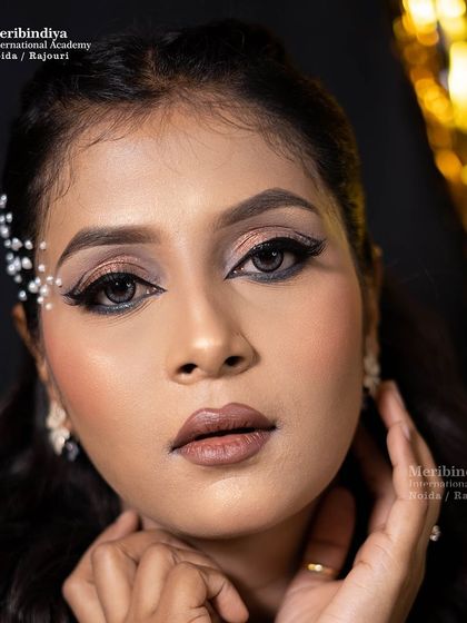 A direct portrait showing the clean, precise makeup application required for celebrity and commercial work.