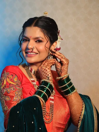 A joyful smile from a stunning bride. Her makeup is designed to be both beautiful in person and flawless in photos, capturing the essence of her happiness.