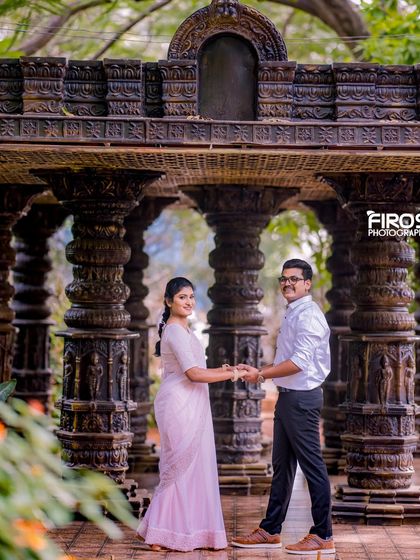 A beautiful shot of a couple in traditional attire within our stone pillar hall, perfect for a classic pre-wedding shoot.