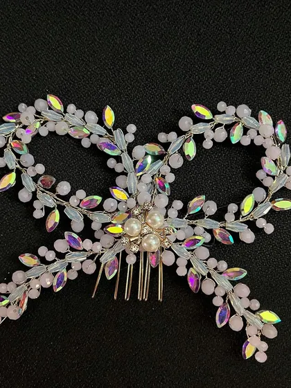Bows are the ultimate hair accessory essential. This one is crafted with iridescent crystals and pearls for a truly unique look.