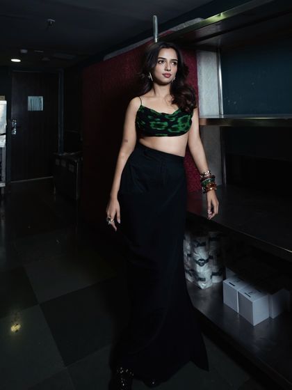 A full-body shot in a different setting, showing how the outfit moves and looks in a more candid, walking pose.