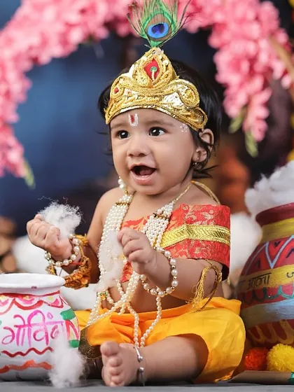 A playful baby Krishna, with a mischievous expression, surrounded by pots of "butter" (cotton) and festive decorations.