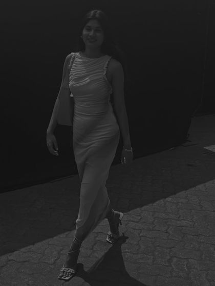 An artistic black and white shot of my Netflix event look. The silhouette of the dress and the movement in this photo create a timeless, cinematic feel.