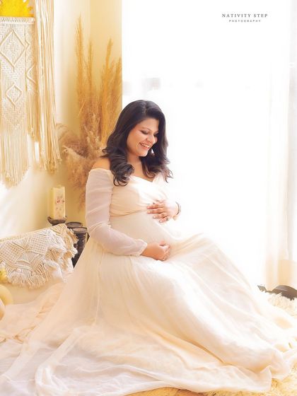 A serene and gentle portrait of a mother-to-be in our beautiful Boho setup. The natural textures and soft light create a peaceful and earthy vibe.
