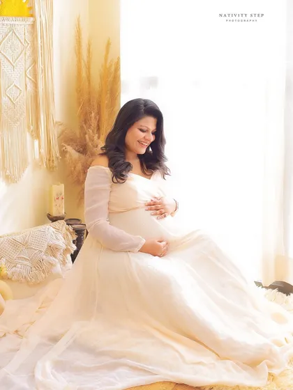 A serene and gentle portrait of a mother-to-be in our beautiful Boho setup. The natural textures and soft light create a peaceful and earthy vibe.