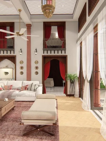 We revitalized a traditional haveli in Old Delhi, creating a 'Baithak' that respects its heritage while introducing modern comforts. The design preserves original features like arched doorways and internal balconies, set within a grand, double-height living space.