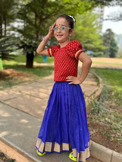 Striking a confident pose. This little dancer is ready to take on the world, one dance step at a time.