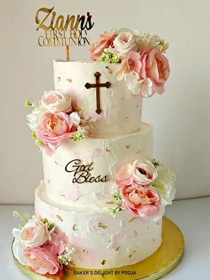 For Ziann's First Holy Communion, I designed this three-tier textured cake to be as divine as the occasion. The soft pink and ivory tones, delicate florals, and gold accents create a sense of grace and celebration for this sacred milestone.