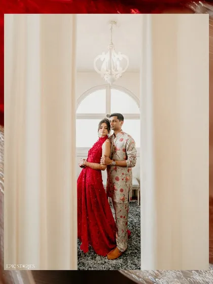 A stylish, editorial portrait of Shifa and Shafeen. The use of curtains as a framing device creates a sense of intimacy and gives the photo a high-fashion feel.