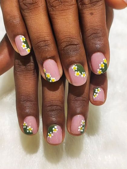 A top-down view of the cute daisy nail art. It’s a fresh and sweet design that’s perfect for spring or summer.