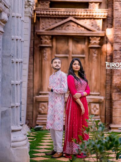 A stylish pose against the same grand doors, showcasing a different mood and composition.