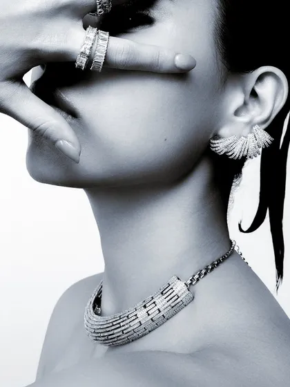 A close-up from a high-end jewelry campaign. My focus here was on creating an intimate and luxurious mood, using composition and shadow to draw the eye directly to the intricate details of the necklace, earrings, and rings. This demonstrates my expertise in styling for fine jewelry.