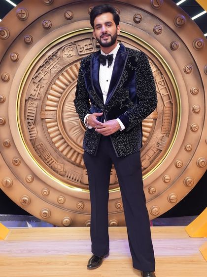 Abhishek Malhan looking confident in our bespoke navy velvet tuxedo. This piece is a perfect example of how we combine classic tailoring with modern, luxurious fabrics.