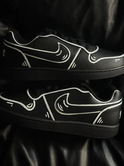 Another pair shot of the cartoon custom sneakers.