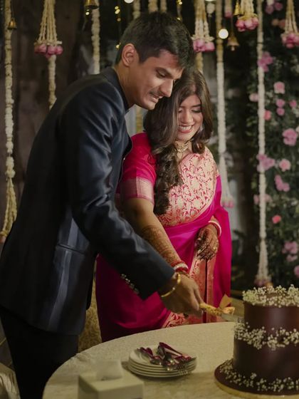 A sweet ending to the formalities and the beginning of a new chapter. The couple cuts their cake, surrounded by the warm and romantic decor we designed for their reception.