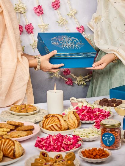 A preview of our Bombay-inspired Diwali Gift Box. The design captures the city's festive magic, from lanterns on art deco buildings to fireworks over the sea.