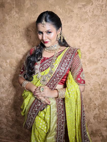 A close-up of the lime green Nauvari, showing the beautiful contrast with the red blouse.