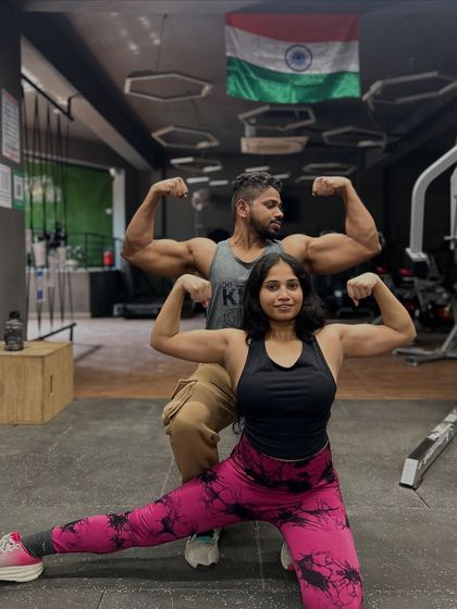 Double biceps pose with my number one. We love celebrating our strength and progress together.